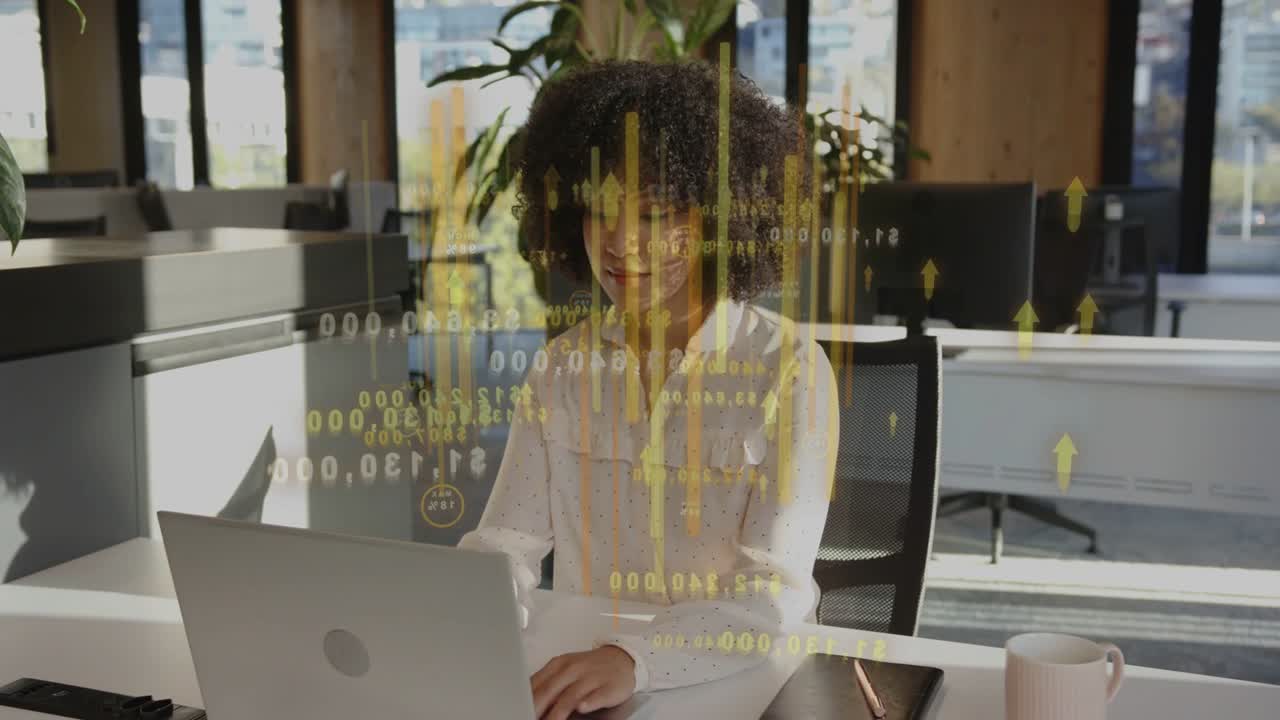 Analyst typing on laptop, initiating yellow data overlay over torso while checking business reports