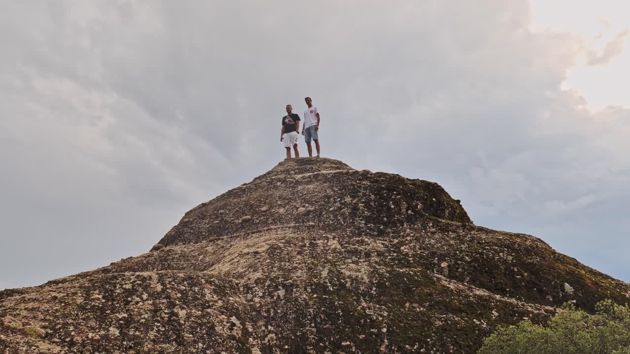 Two Men on a Mountaintop