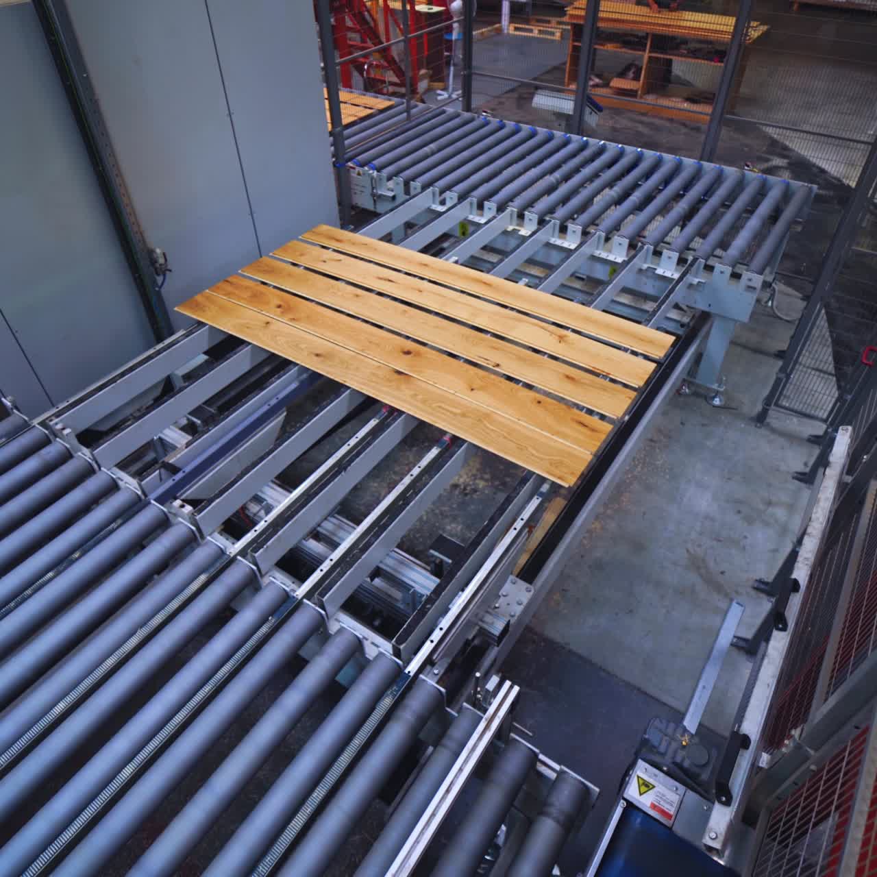 Automated equipment of a parquet factory. Industrial process of furniture production. Interior of modern robotic plant.