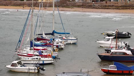 boats docked near coastal town in fife, scotland