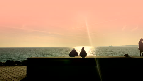 Couple-on-the-beach-board-walk