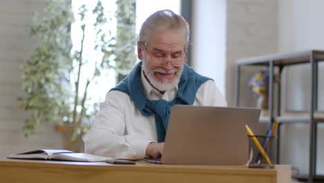 Senior Man Working on Laptop