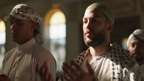muslim men praying in a mosque