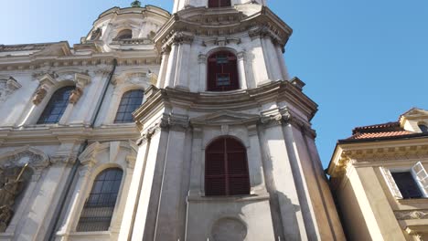 st. nicholas church in prague captured from below on a clear sunny day with intricate details