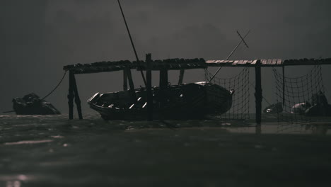 abandoned fishing boat at night