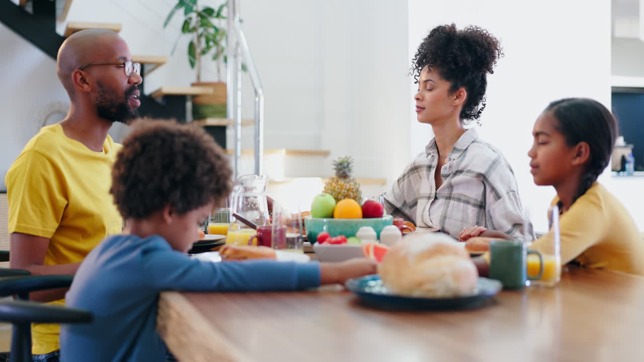 Home, prayer and family with kids at lunch