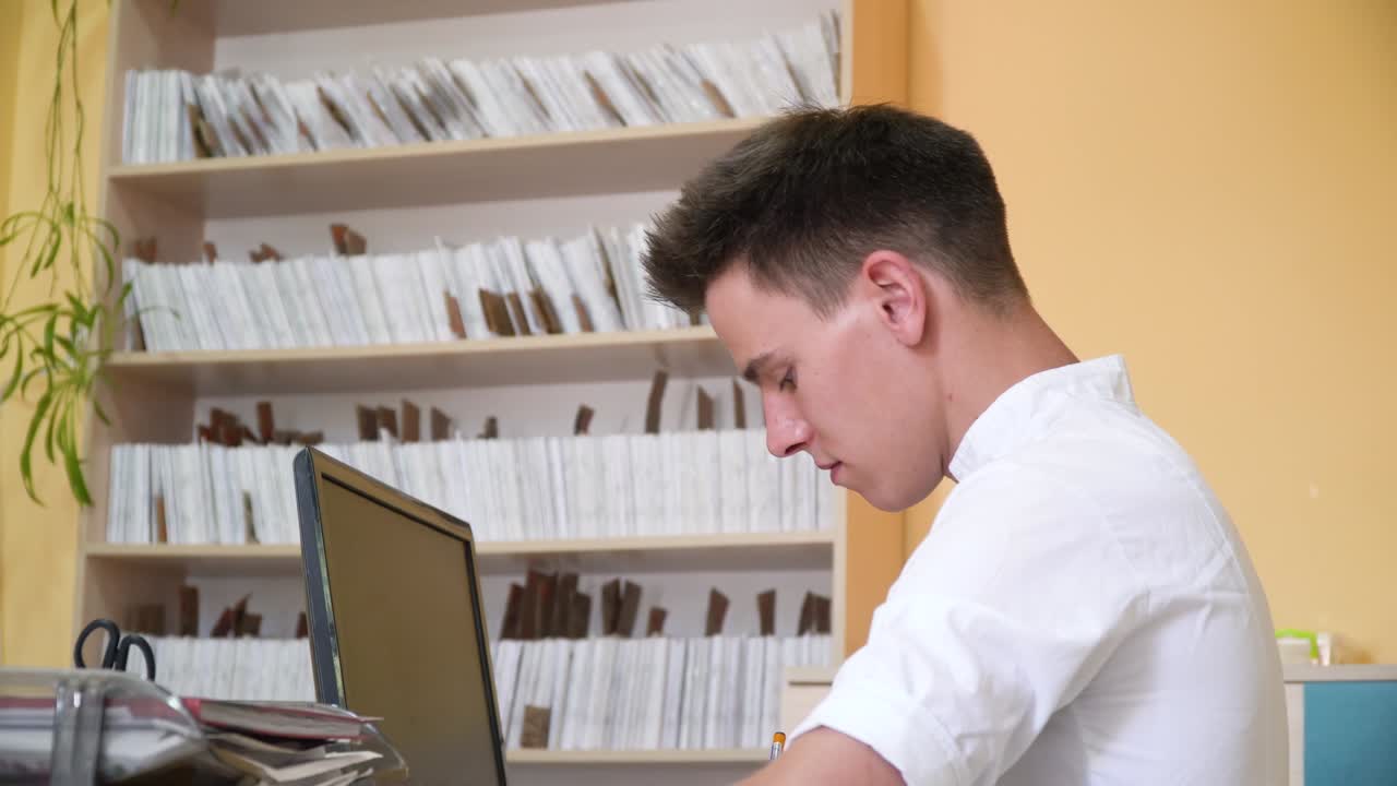 Young intern studies at the clinic. Online education concept