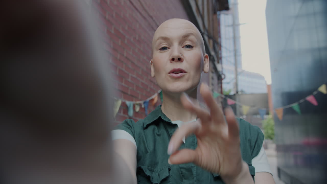 Woman taking selfie in an urban alley