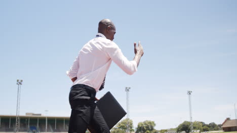 Businessman-running-with-briefcase