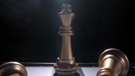 gold king on chess board last survivor, dramatic twirling smoke behind