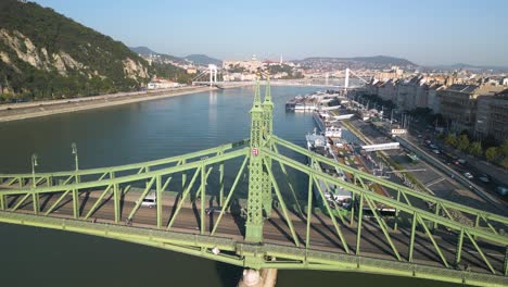 Cinematic-Orbiting-Shot-Above-Liberty-Bridge-and-Danube-River-in-Budapest,-Hungary