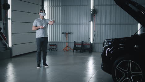 man using virtual reality headset to interact with car in garage