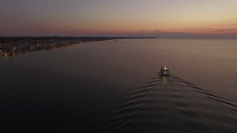 aerial flight above the sea and coast line on the horizon in greece