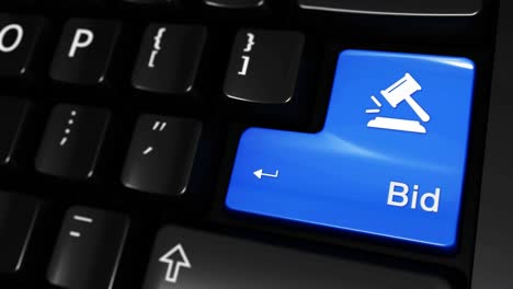 Closeup of a computer keyboard with a blue bid button