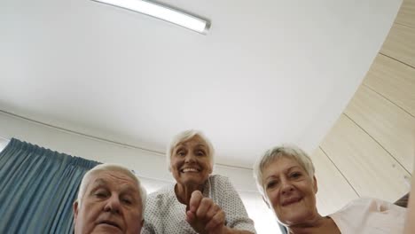 Senior-man-and-woman-interacting-in-old-age-home