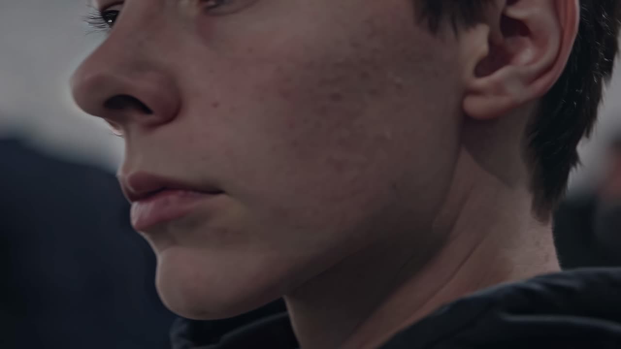 Close-up video shot of a person's ear from a side angle, focusing on texture and detail