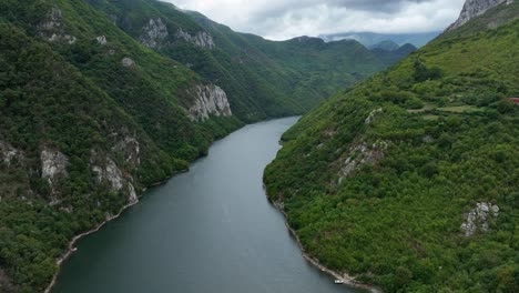 green mountains of lake komani in albania - aerial drone shot
