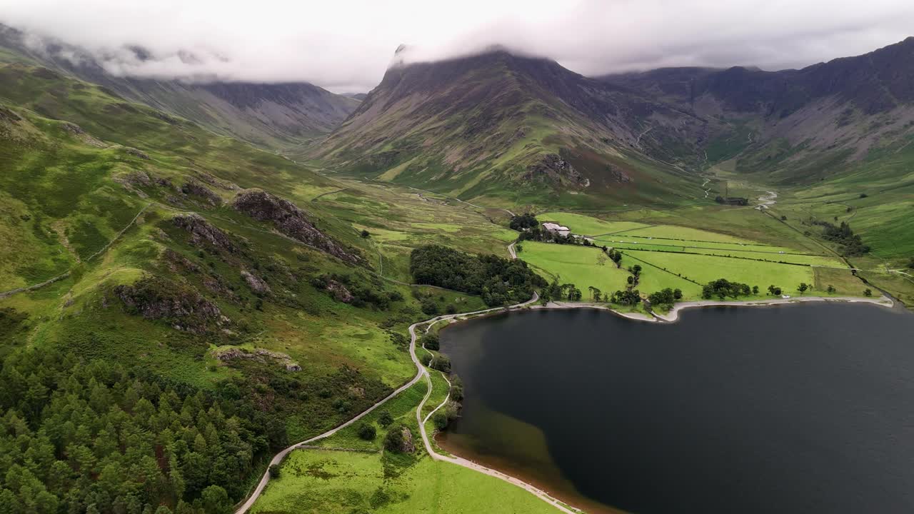 aerial footage of Buttermere lake and Honister Pass in the Lake District National Park in Cumbria in the UK,