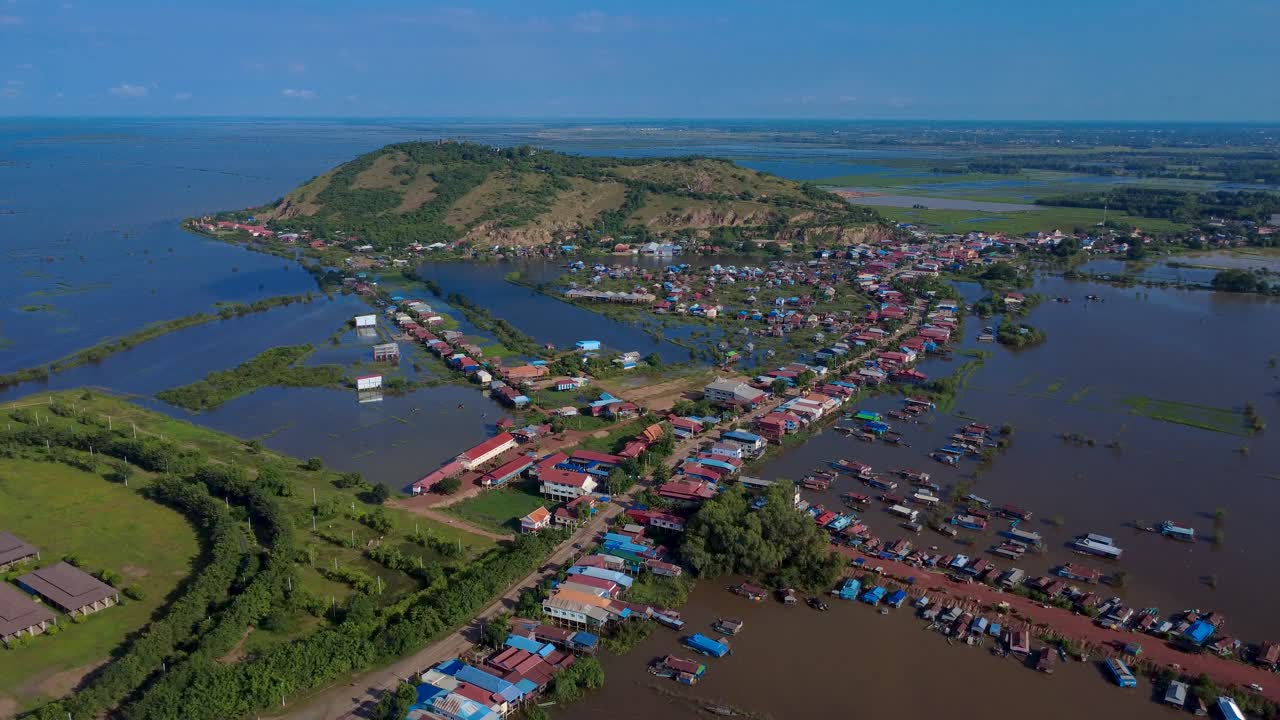 Drone view of floating village on Tonle Sap Lake, tranquil and serene