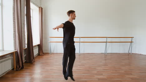 male dancer practicing dynamic moves in a studio