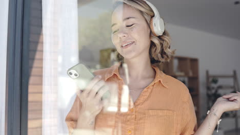 Window,-Asian-woman-and-headphones