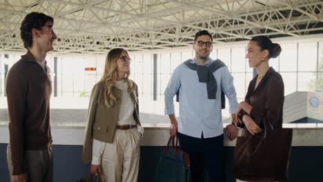 group of friends talking in an indoor hall