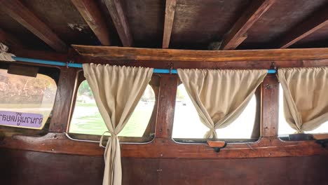 curtains parting to show outdoor landscape