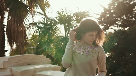 young woman in a park sweater