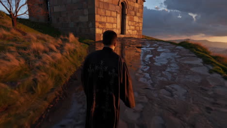 monk walking on mountain path at sunset