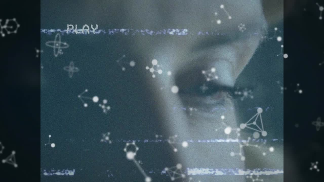 Animation of play digital interface on screen with molecules over woman's face
