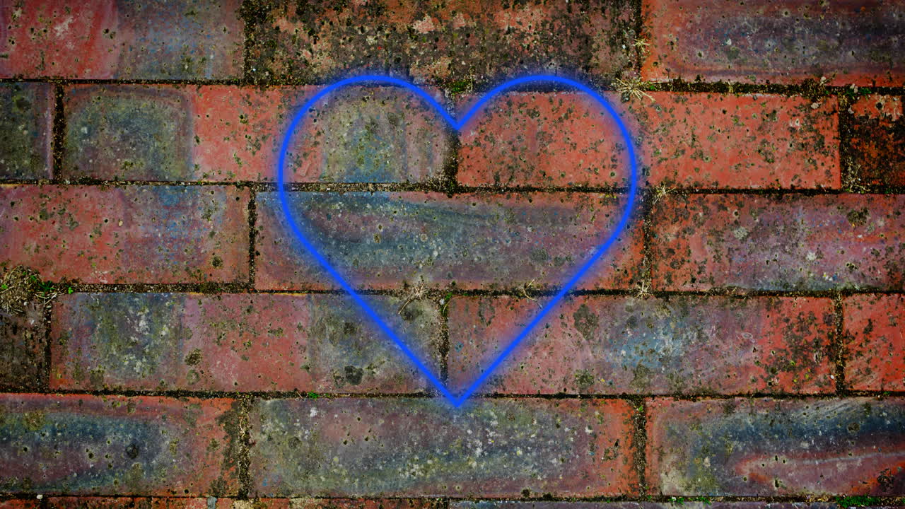 Insegna al neon a forma di cuore su muro di mattoni 4k