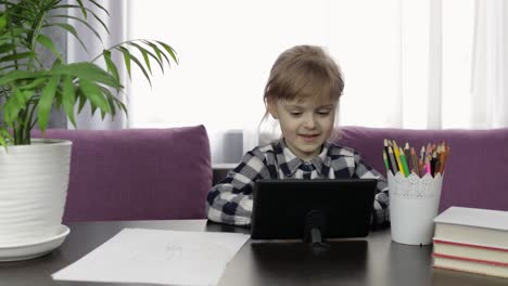 Girl-studying-online-homework-using-digital-tablet-computer.-Distance-education