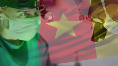 animation of flag of cameroon over surgeons in operating theatre