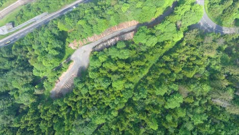 morschach flyover: moving over scenic water valley towards alps mountains, switzerland, europe, drone | very close inland movement above hillside to vast majestic blue lake