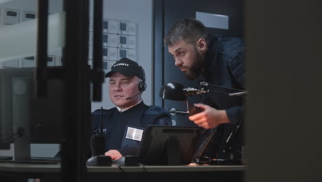 security guards working in a control room