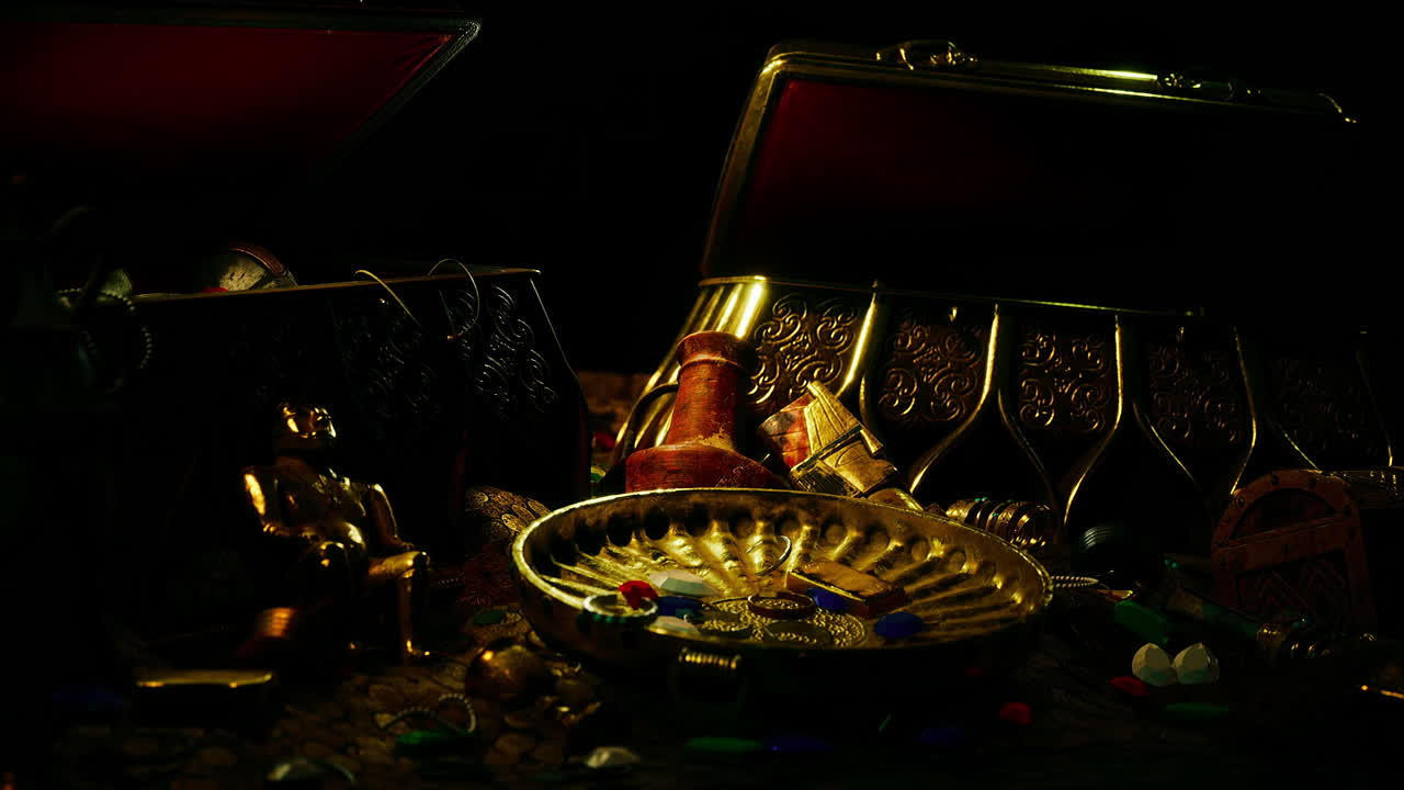 un puñado de joyas de oro en un fondo oscuro