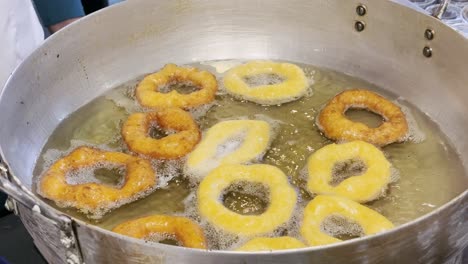 picarones a traditional peruvian dessert being cooked