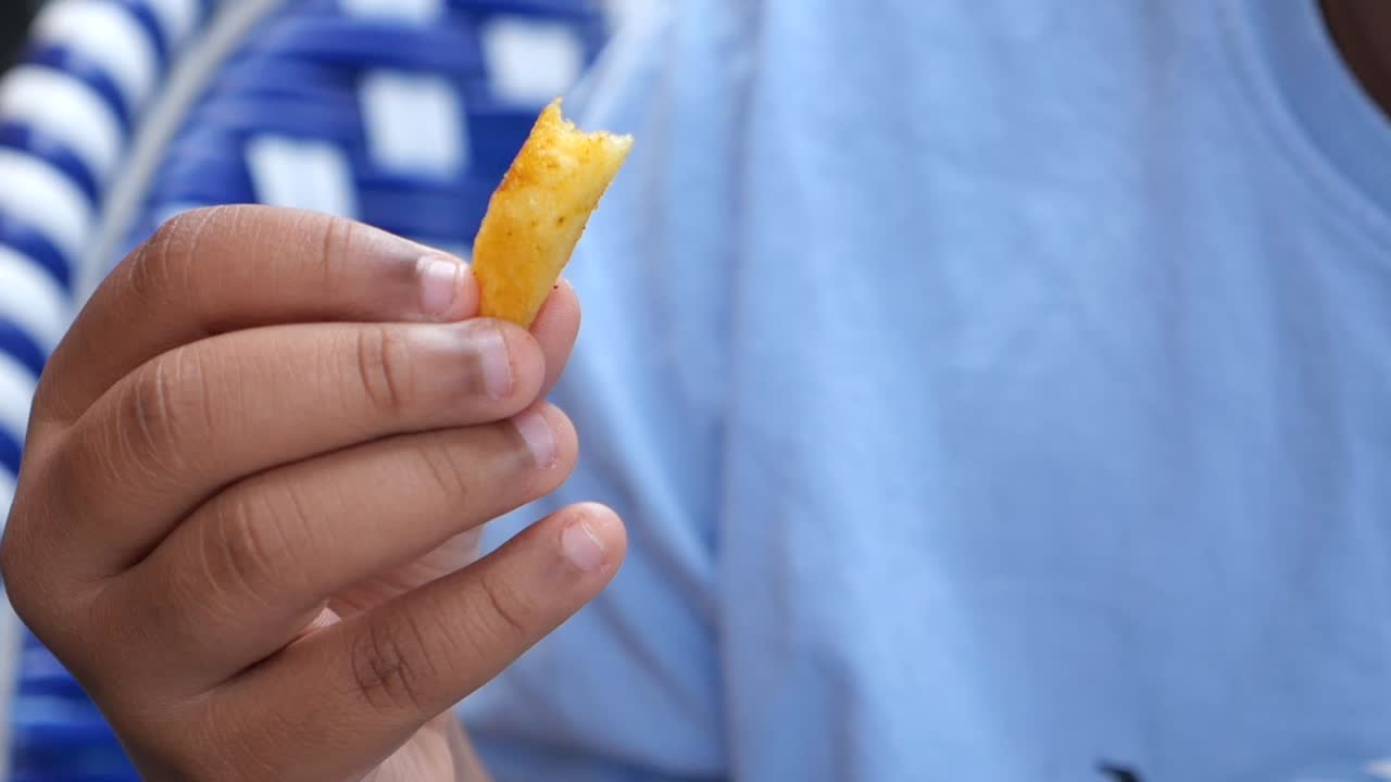 Child Eating a French Fry