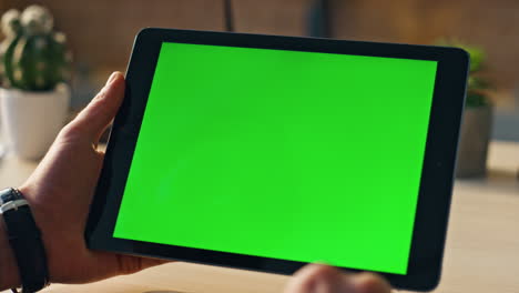 unknown businessman scrolling chroma key tablet working online at office closeup