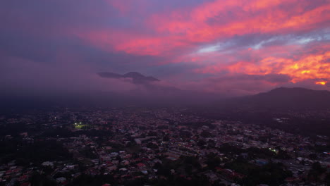 Stunning-unusual-sunset-in-the-city-with-unbelievable-colors-mountains-and-a-small-rainstorm