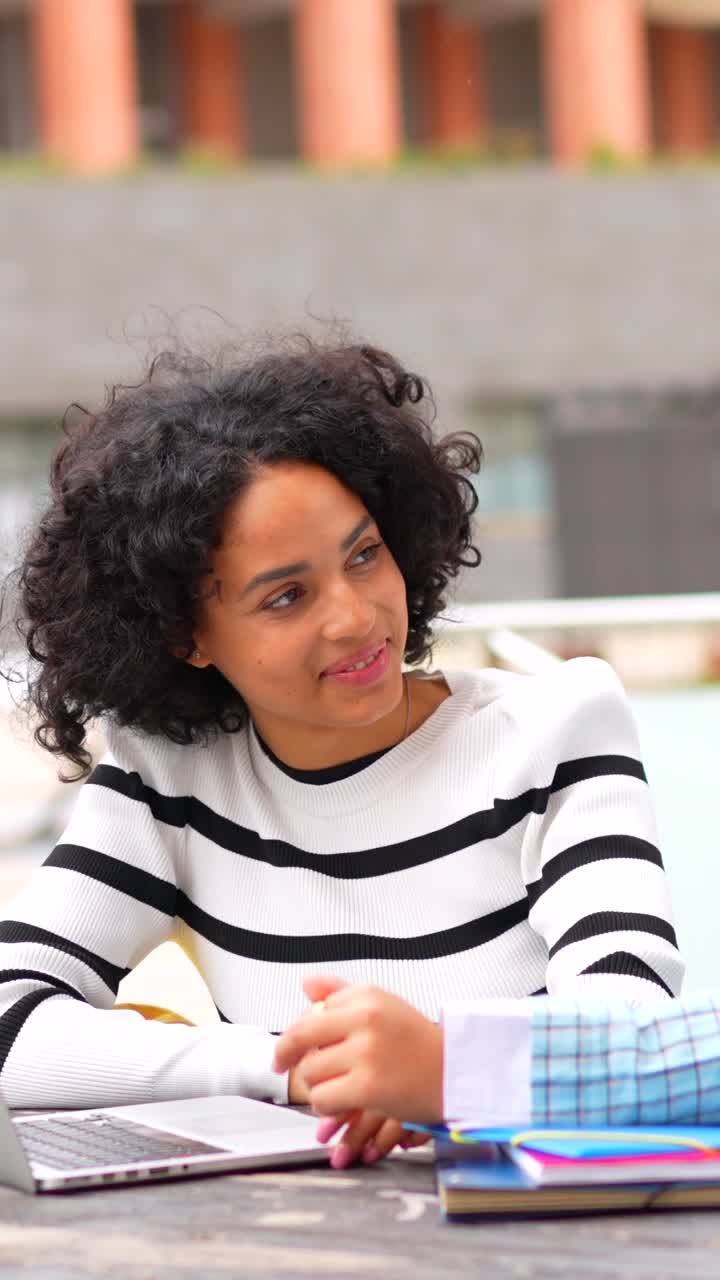 Two Women Engaging in Conversation