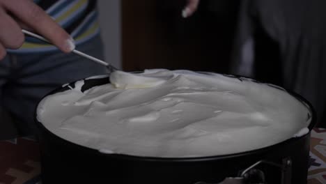 home baking - smoothing cream on banoffee pie