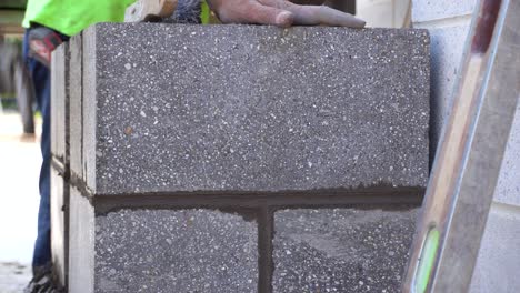 Close-up-grout-brushing-of-concrete-pillar