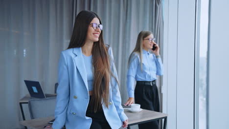 two businesswomen in a modern office