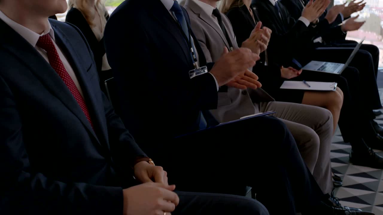 Business audience applaud at training