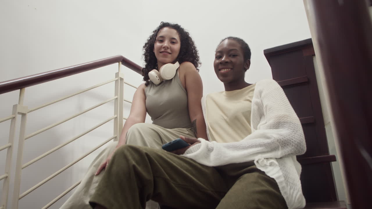 Portrait of Friends Sitting on Stairs