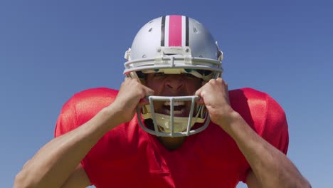 american football player screaming with helmet