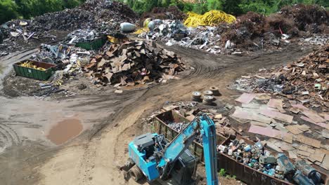 pushing drone view of scrapyard to baseball field and park on a bright sunny day