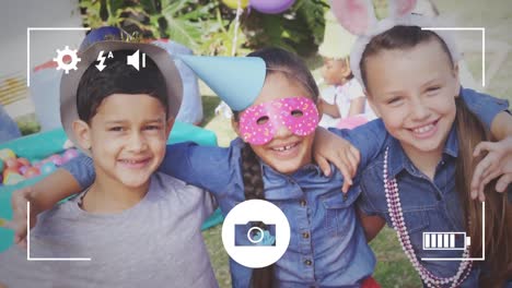 taking photos of children at party on a digital camera
