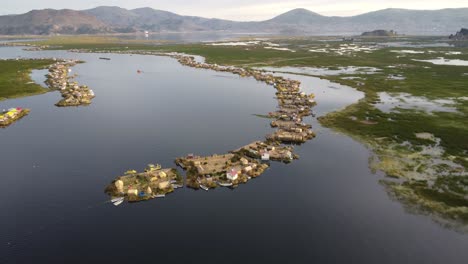 drone shot of floating villages on lake titicaca in peru